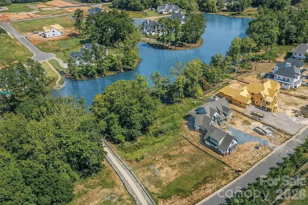 an aerial view of house with yard