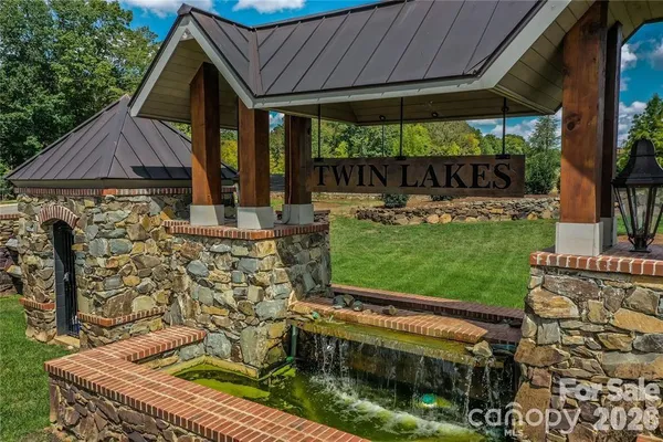 a view of house with backyard space and garden