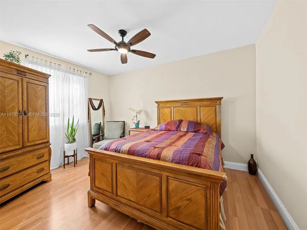 a bed room with a bed and a window