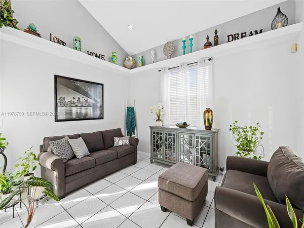 a living room with furniture and white walls
