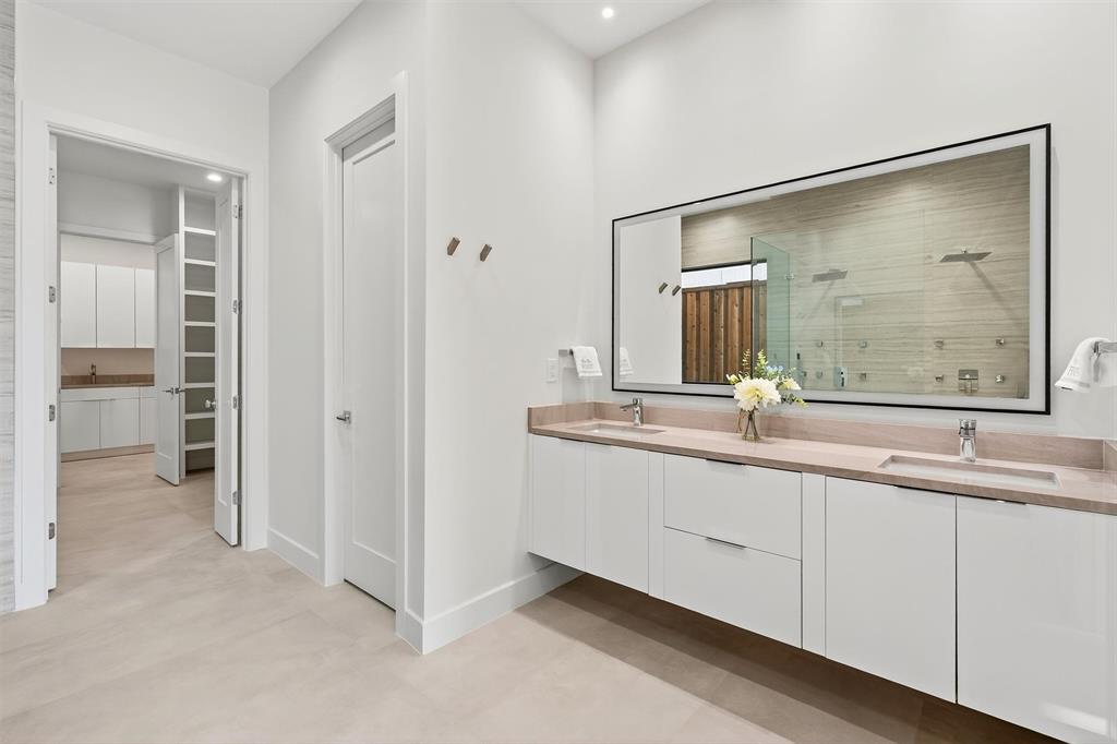 7619 Robin Road Dallas, TX 75209 - Photo 18 of 40 a bathroom with 2 sink and a mirror