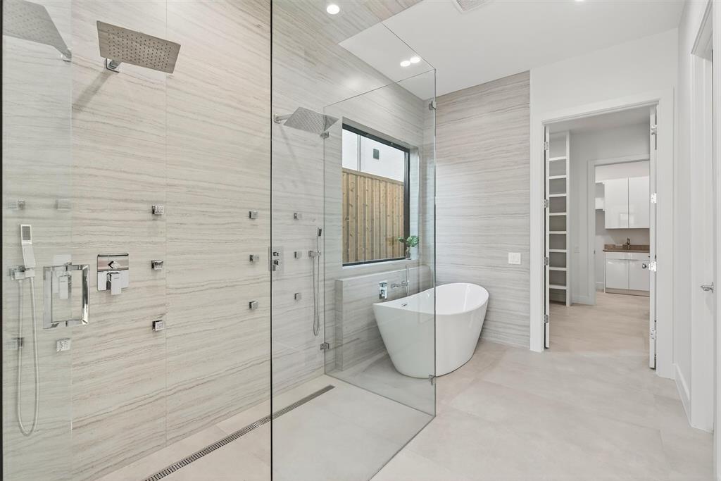 7619 Robin Road Dallas, TX 75209 - Photo 19 of 40 a bathroom with a bathtub and shower