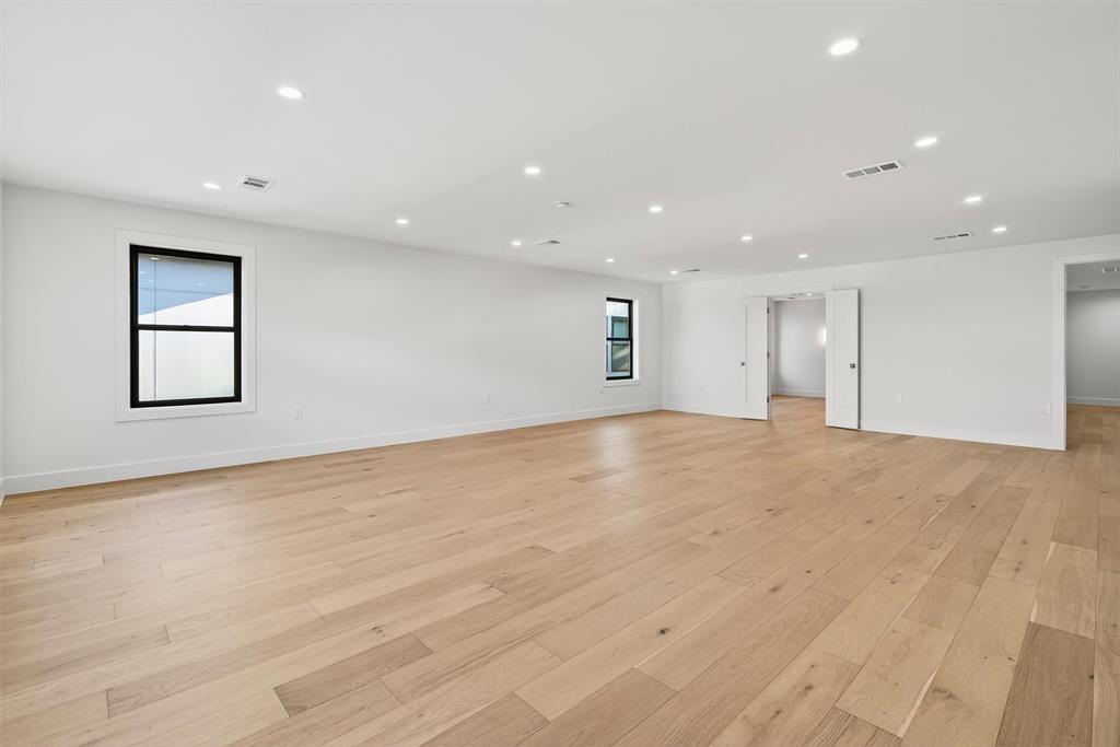 7619 Robin Road Dallas, TX 75209 - Photo 24 of 40 a view of an empty room with wooden floor and a window