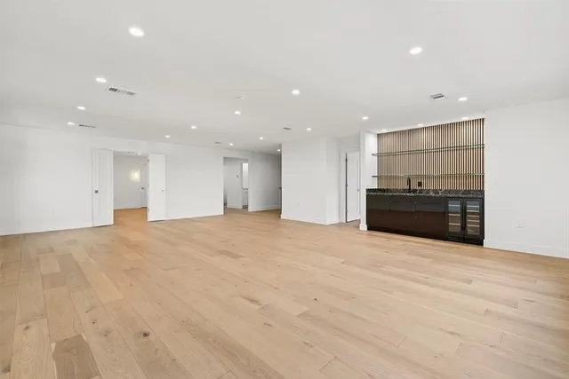 a bathroom with a double vanity sink toilet and shower