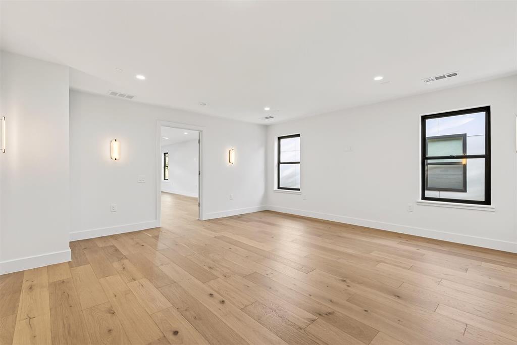 7619 Robin Road Dallas, TX 75209 - Photo 27 of 40 Empty room featuring light wood finished floors and recessed lighting