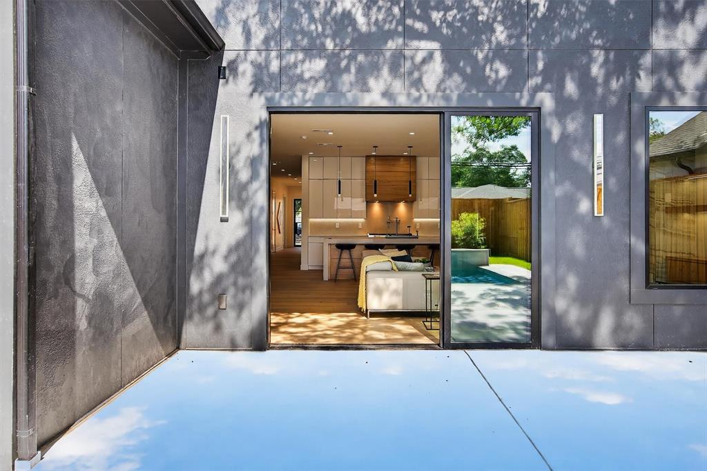 7619 Robin Road Dallas, TX 75209 - Photo 38 of 40 a view of living room kitchen with furniture and floor to ceiling window