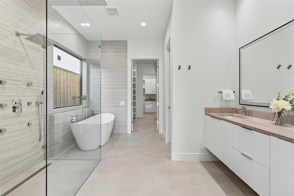 7619 Robin Road Dallas, TX 75209 - Photo 5 of 40 a bathroom with a granite countertop sink mirror and bathtub