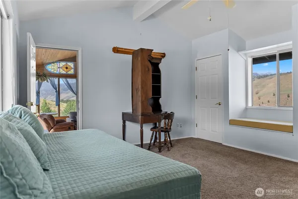 a bedroom with a bed and a table in it