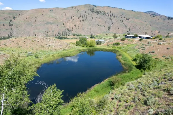 a view of a lake with a yard