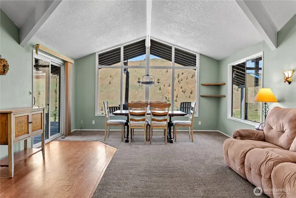 a living room with furniture and a table