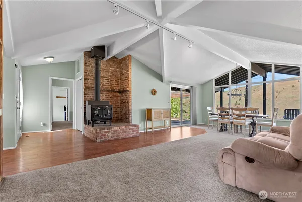 a living room with furniture window and wooden floor
