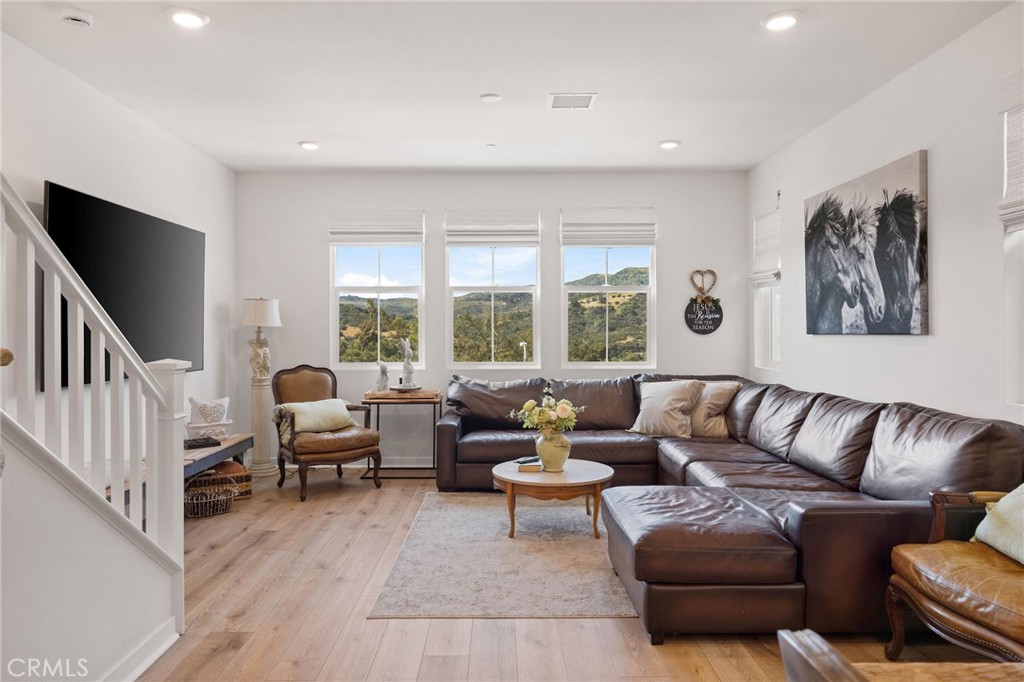 840 Barrel Way Rancho Mission Viejo, CA 92694 - Photo 11 of 57 a living room with furniture and a large window