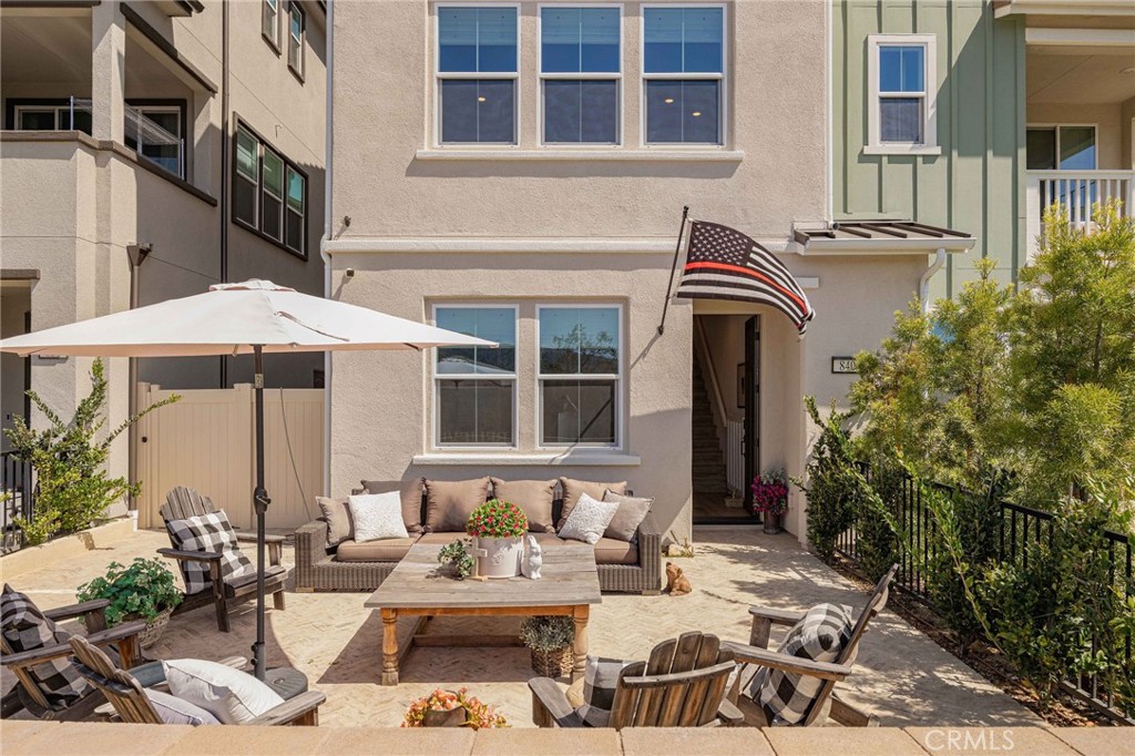 840 Barrel Way Rancho Mission Viejo, CA 92694 - Photo 2 of 57 a view of a patio with couches table and chairs and potted plants