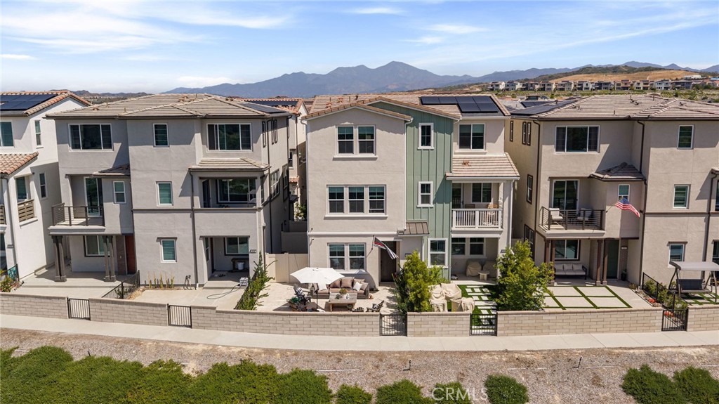 840 Barrel Way Rancho Mission Viejo, CA 92694 - Photo 33 of 57 a front view of a residential apartment building with a yard