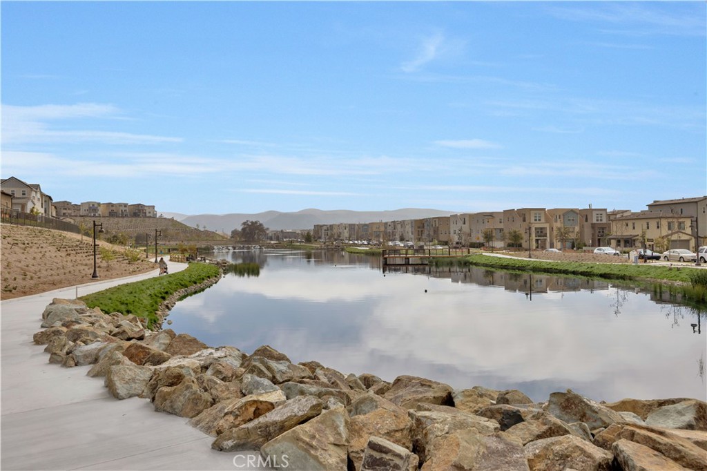 840 Barrel Way Rancho Mission Viejo, CA 92694 - Photo 40 of 57 a view of a lake with couches and city view