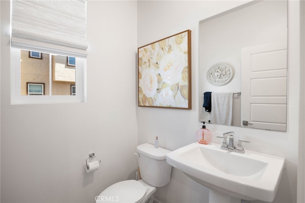 840 Barrel Way Rancho Mission Viejo, CA 92694 - Photo 57 of 57 a bathroom with a toilet sink and mirror