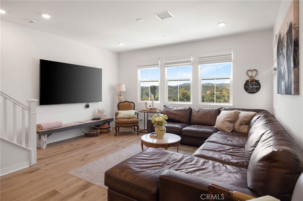 840 Barrel Way Rancho Mission Viejo, CA 92694 - Photo 10 of 57 a living room with furniture and a flat screen tv