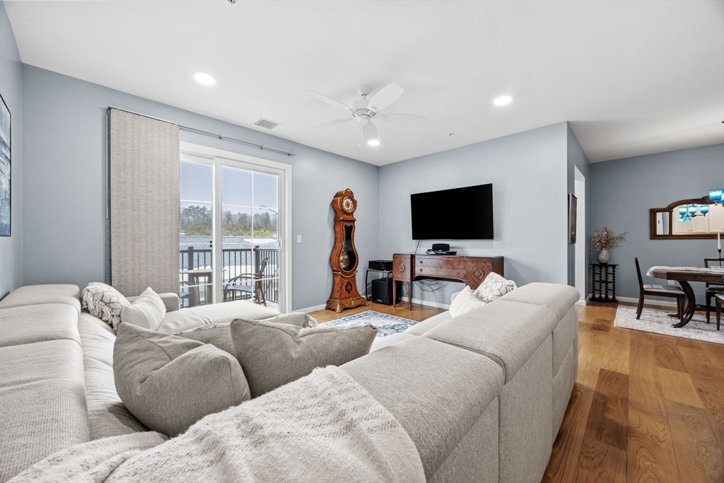 1 Mariner's Way, Unit 204 Plymouth, MA 02360 - Photo 13 of 36 a living room with furniture and a flat screen tv