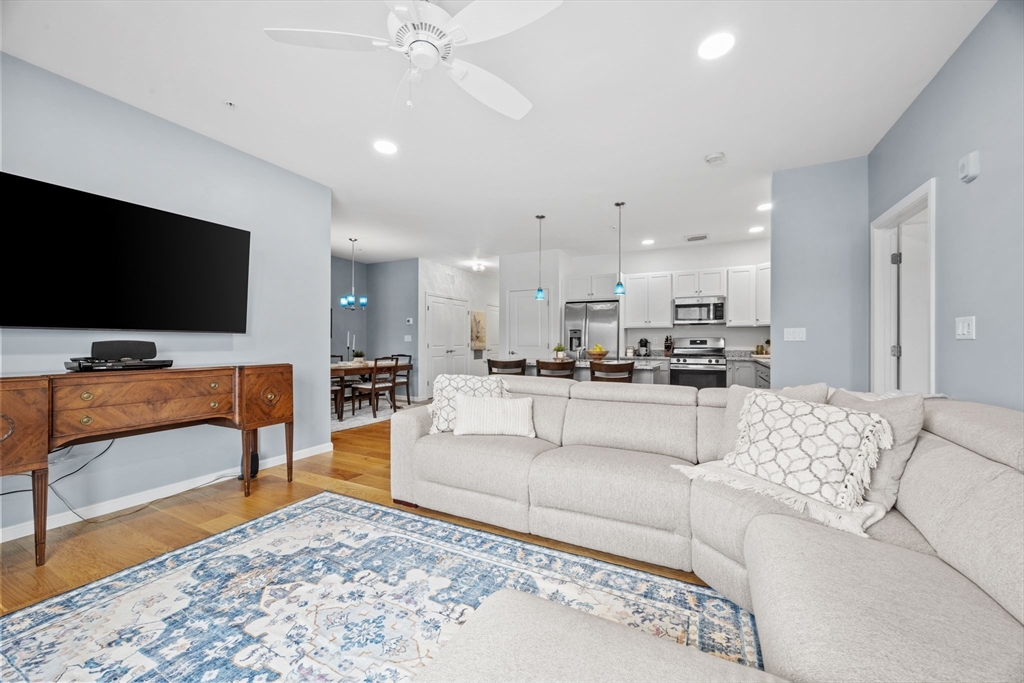 1 Mariner's Way, Unit 204 Plymouth, MA 02360 - Photo 16 of 36 a living room with furniture and a flat screen tv