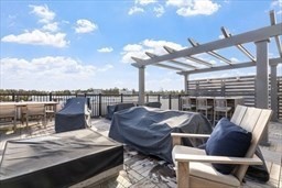 1 Mariner's Way, Unit 204 Plymouth, MA 02360 - Photo 35 of 36 a view of a terrace with furniture and a potted plant