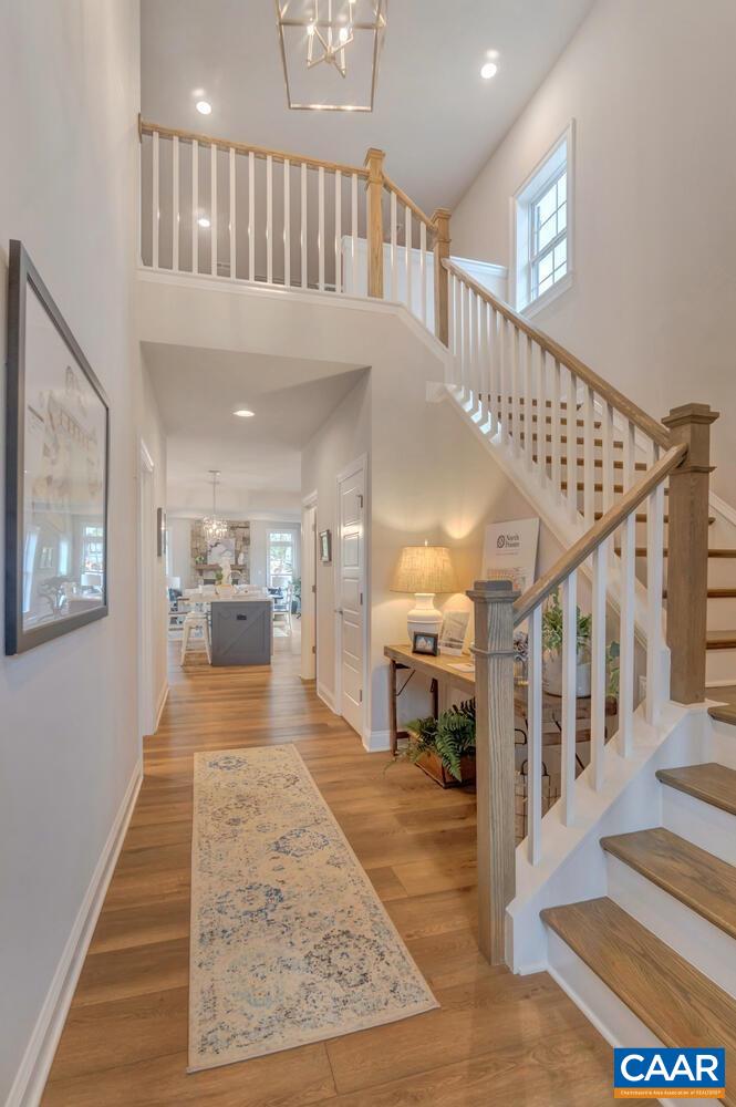 2132 Northside Drive Charlottesville, VA 22911 - Photo 2 of 21 a view of a hallway with wooden floor and stairs