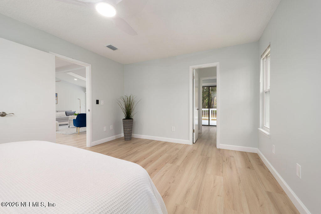 3819 Julington Creek Road Jacksonville, FL 32223 - Photo 11 of 36 a bedroom with a bed and a window