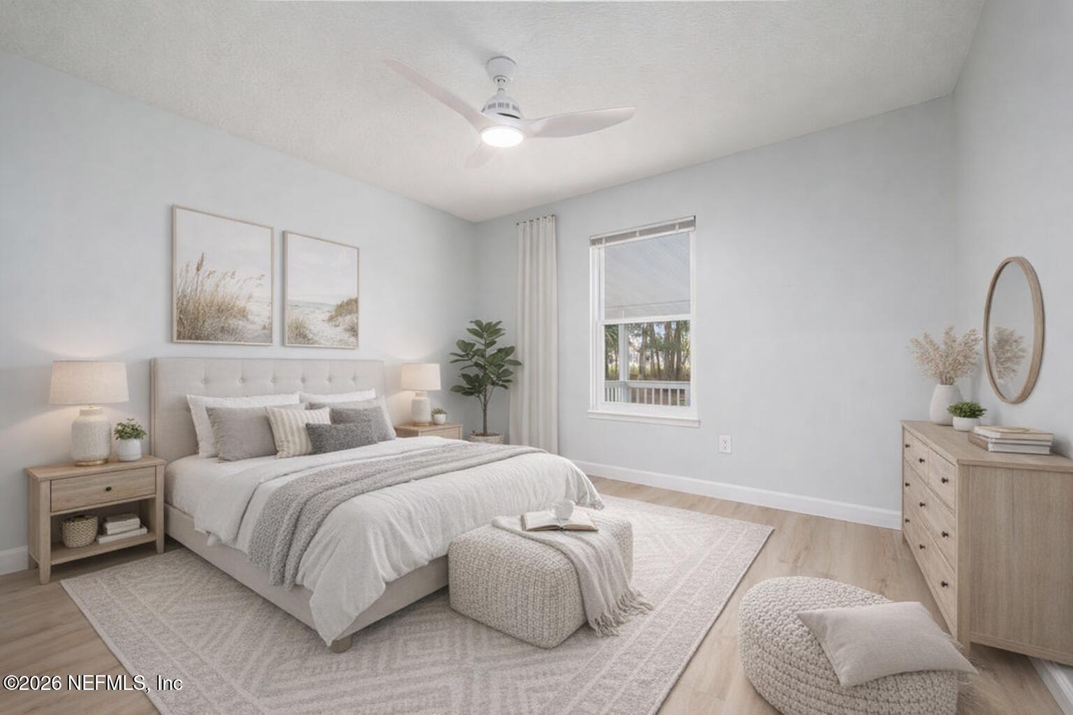 3819 Julington Creek Road Jacksonville, FL 32223 - Photo 16 of 36 a bedroom with a bed and a chandelier