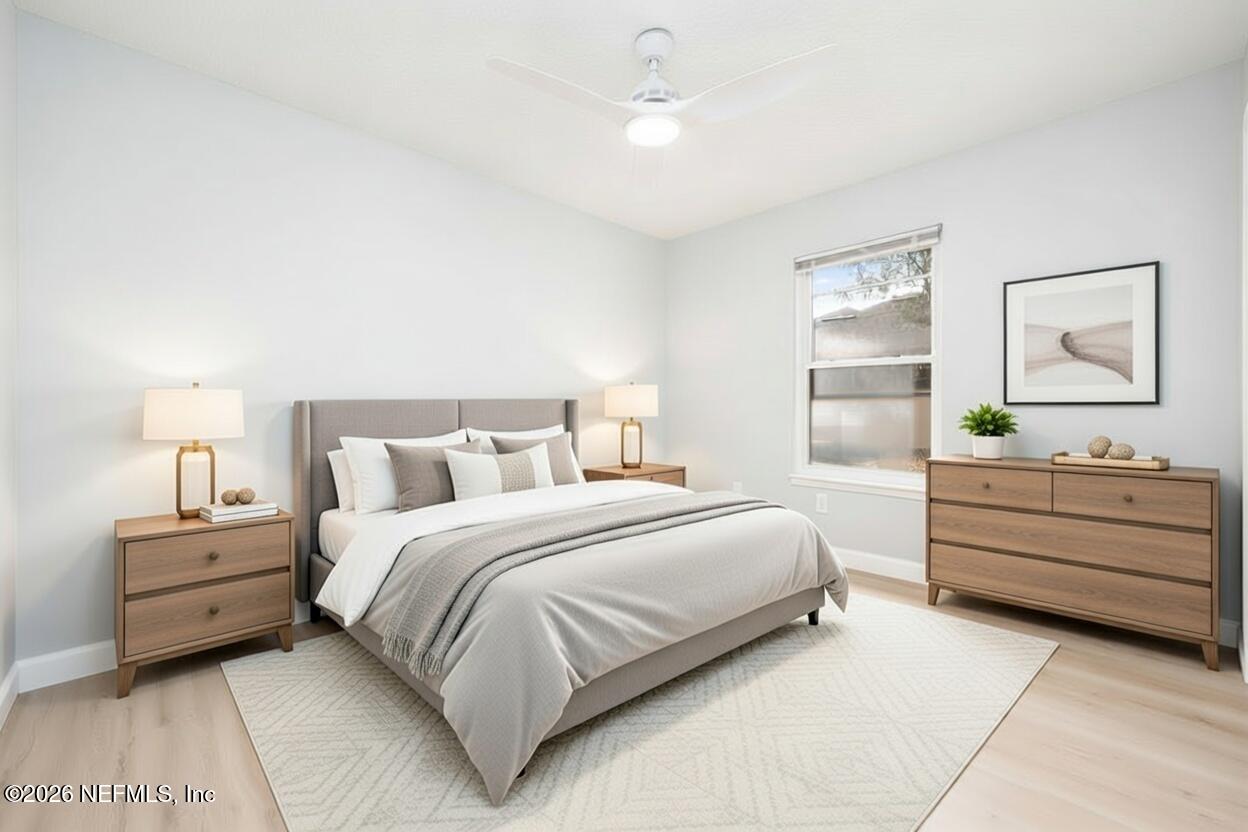 3819 Julington Creek Road Jacksonville, FL 32223 - Photo 20 of 36 a bedroom with a bed and a night stand