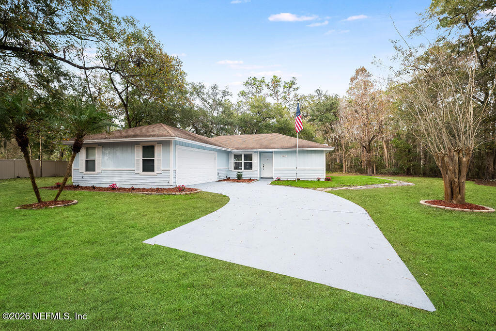 3819 Julington Creek Road Jacksonville, FL 32223 - Photo 2 of 36 a front view of house with yard and green space