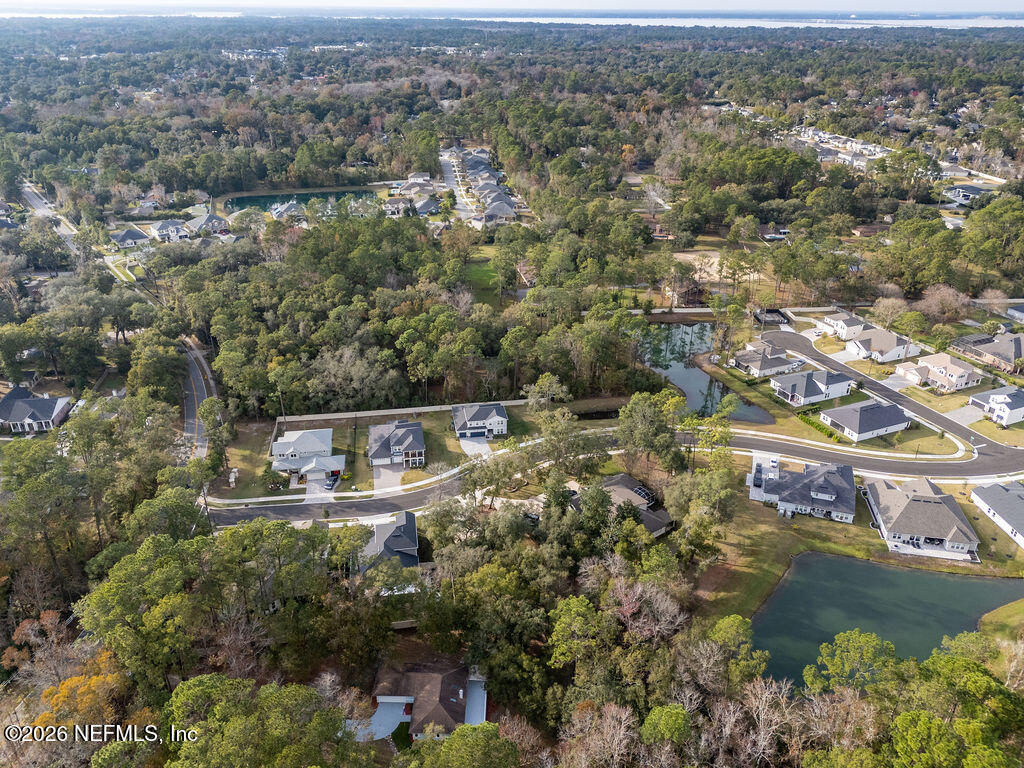 3819 Julington Creek Road Jacksonville, FL 32223 - Photo 31 of 36 an aerial view of house with yard and lake view