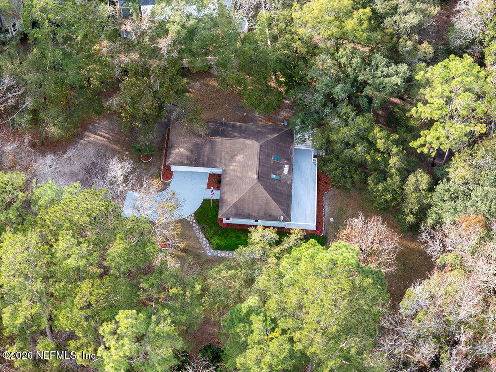 3819 Julington Creek Road Jacksonville, FL 32223 - Photo 32 of 36 an aerial view of a house with a yard and trees