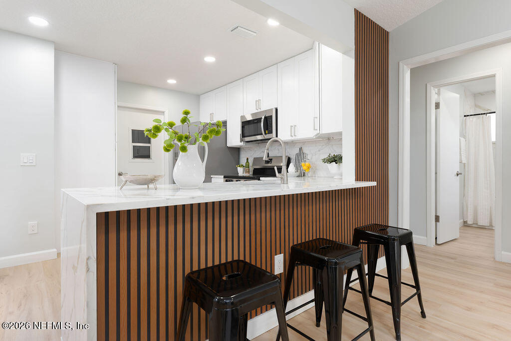 3819 Julington Creek Road Jacksonville, FL 32223 - Photo 7 of 36 a kitchen with a table and chairs in it