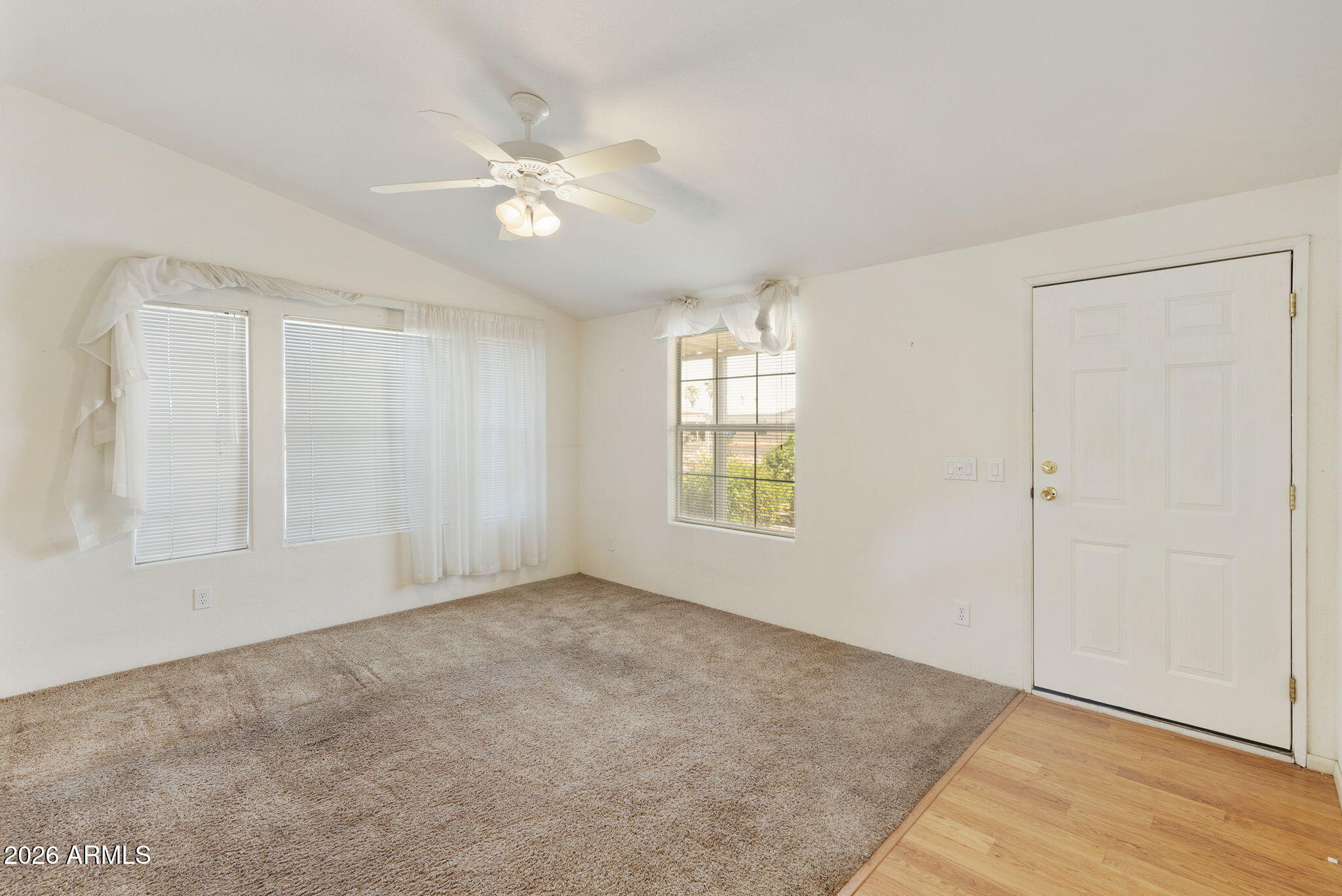 3700 South Tomahawk Road, Unit 73 Apache Junction, AZ 85119 - Photo 25 of 49 a view of an empty room with a window