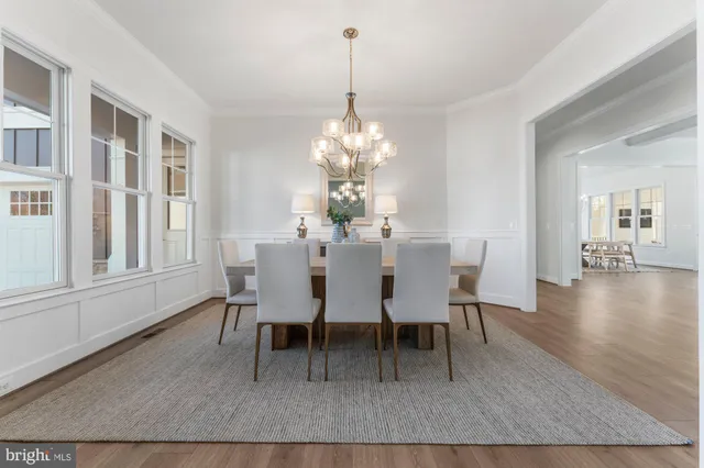 a kitchen with stainless steel appliances white cabinets and a stove