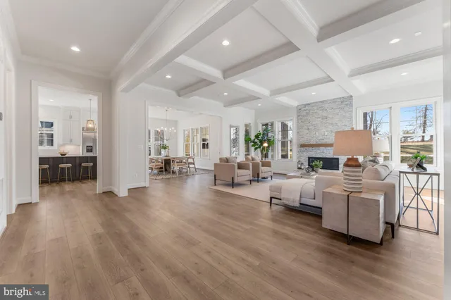a view of a dining room with furniture wooden floor and chandelier