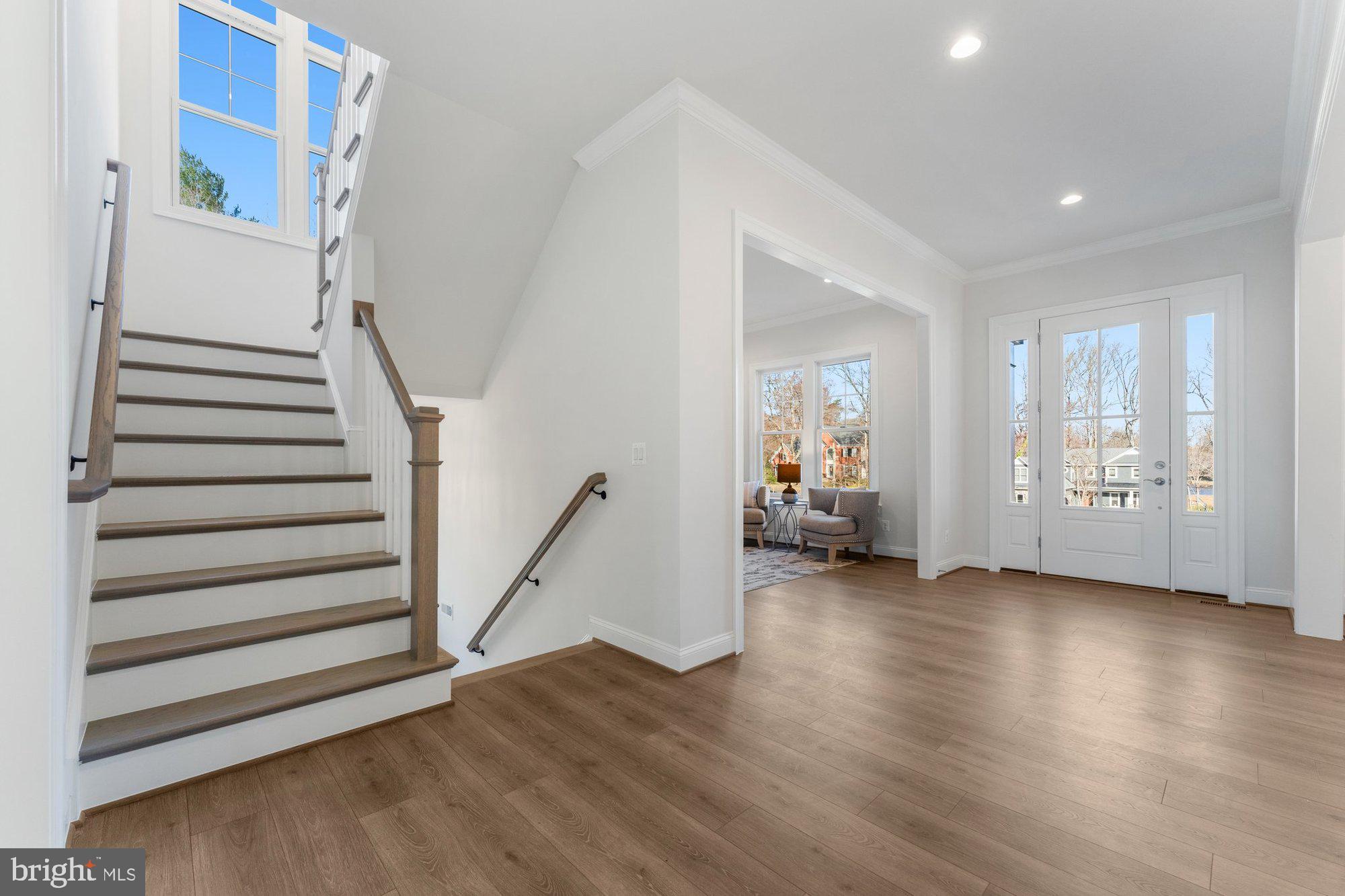 1767 Proffit Road Vienna, VA 22182 - Photo 22 of 117 a view of a livingroom with wooden floor and stairs