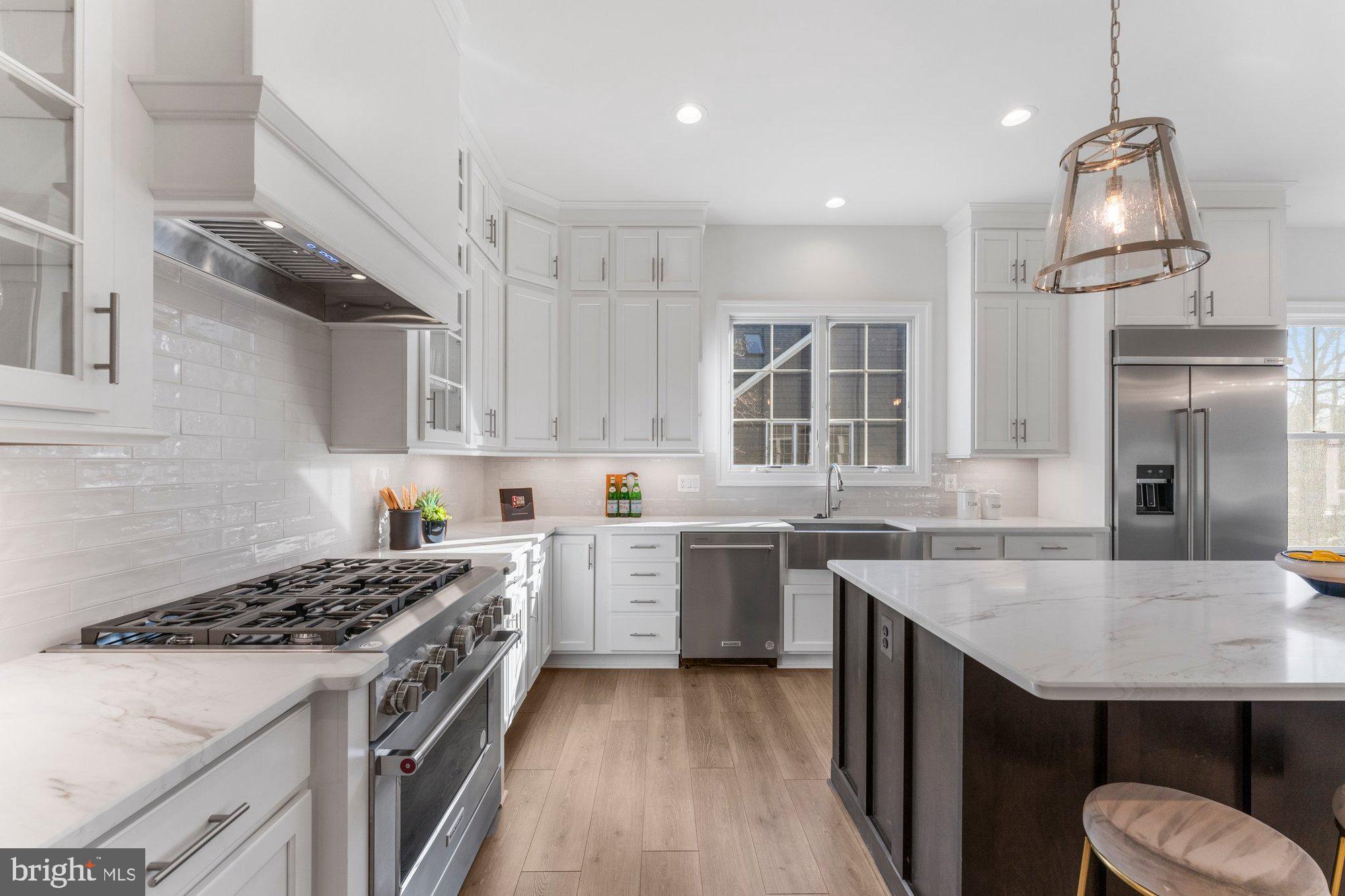 1767 Proffit Road Vienna, VA 22182 - Photo 32 of 117 a kitchen with a sink a stove and cabinets