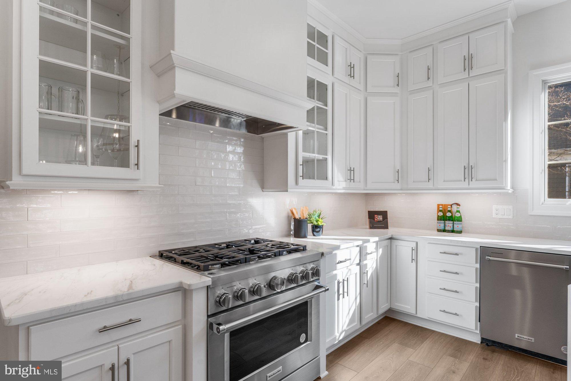 1767 Proffit Road Vienna, VA 22182 - Photo 33 of 117 a kitchen with cabinets appliances and a window