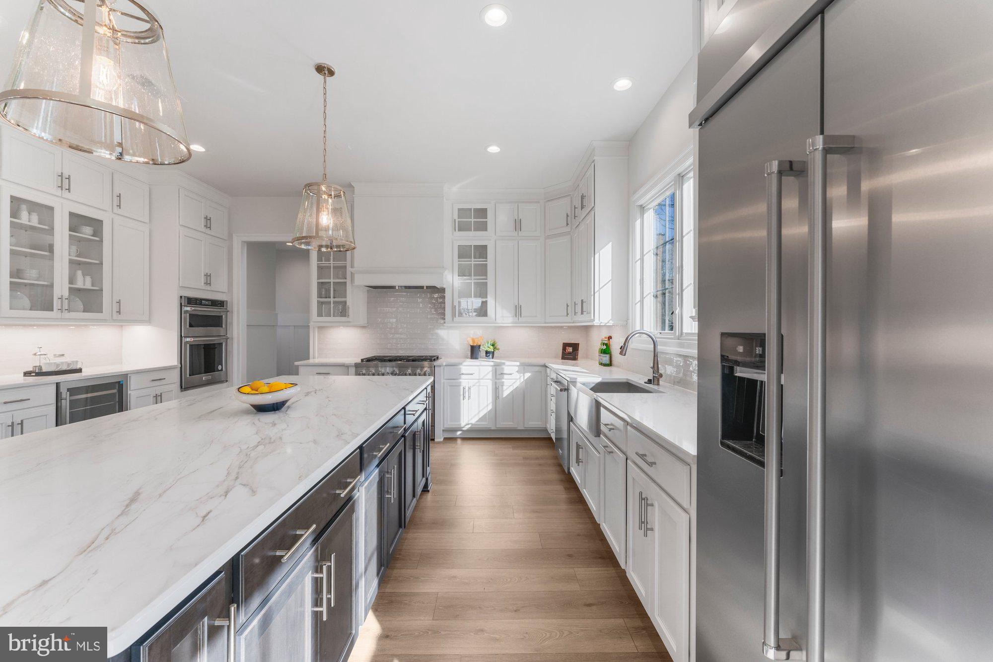 1767 Proffit Road Vienna, VA 22182 - Photo 35 of 117 a kitchen with stainless steel appliances granite countertop a sink a stove and a refrigerator