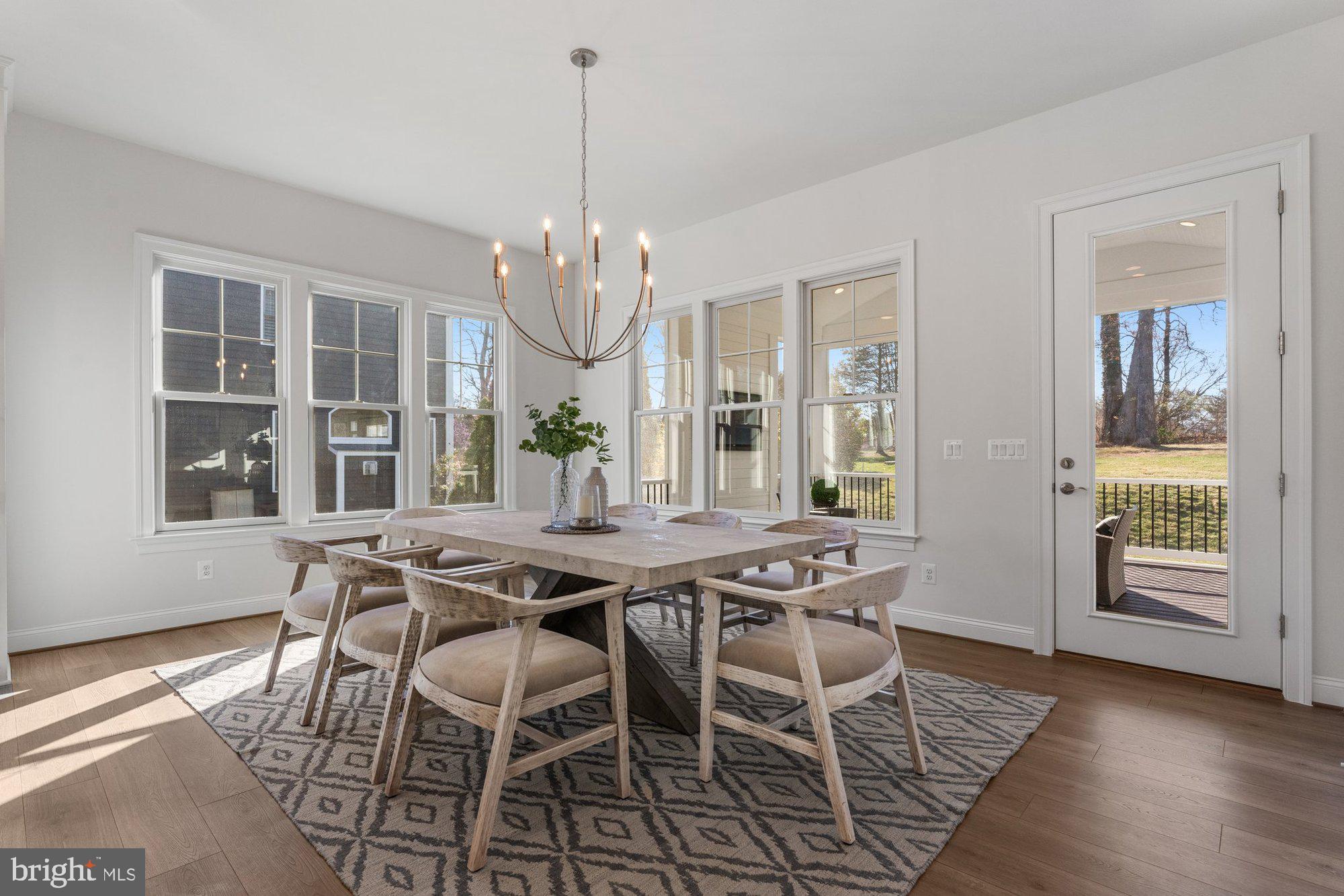 1767 Proffit Road Vienna, VA 22182 - Photo 39 of 117 a view of a dining room with furniture wooden floor and chandelier