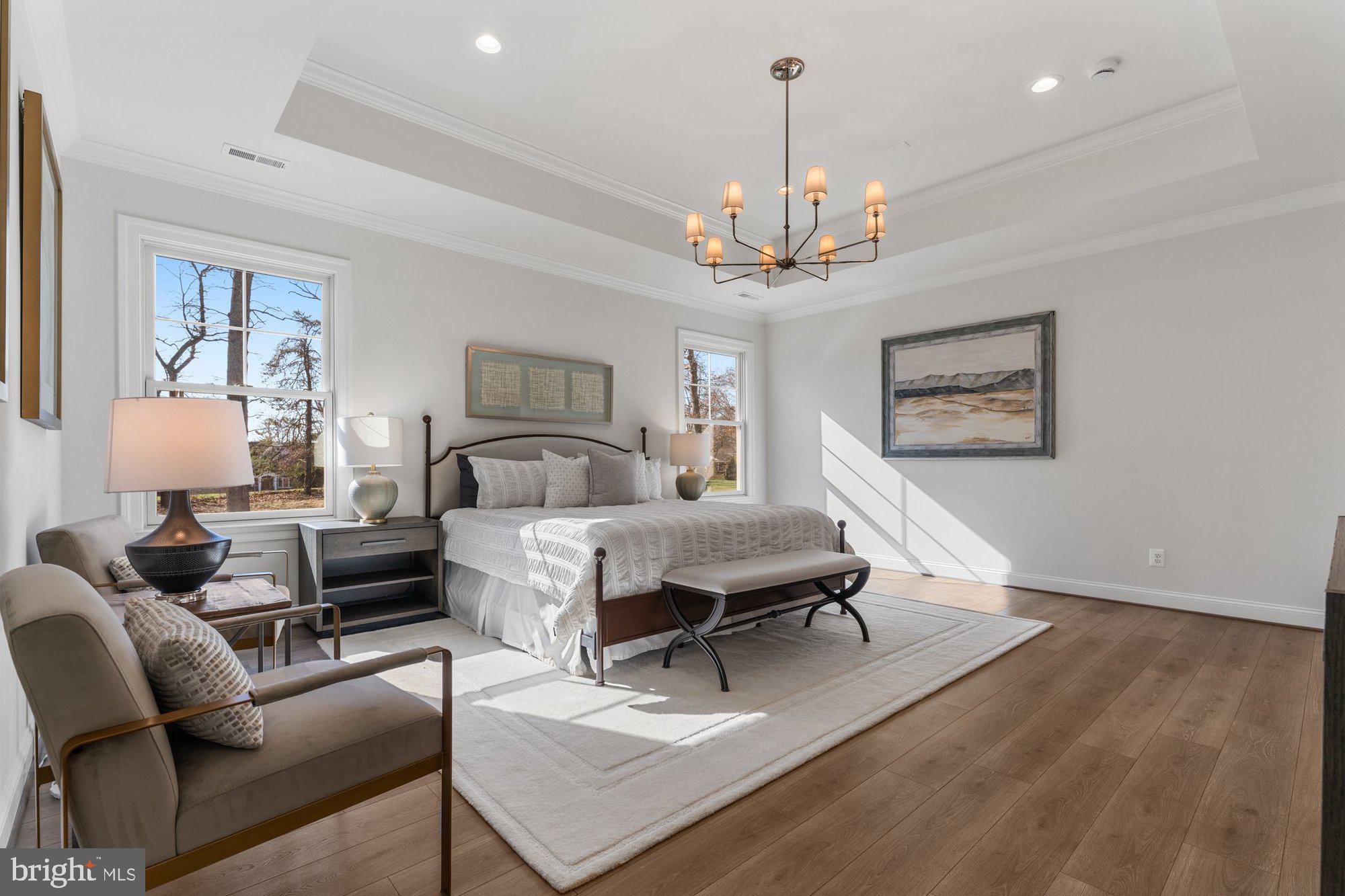 1767 Proffit Road Vienna, VA 22182 - Photo 4 of 117 a spacious bedroom with a bed a couch and dresser