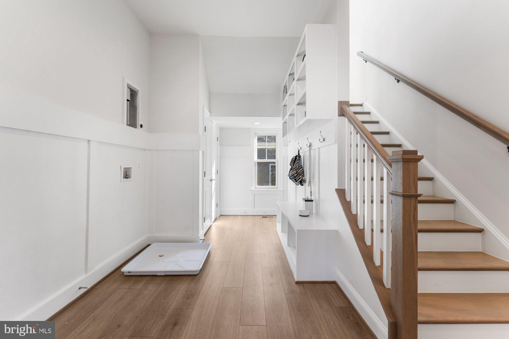 1767 Proffit Road Vienna, VA 22182 - Photo 45 of 117 a view of a hallway with wooden floor and staircase