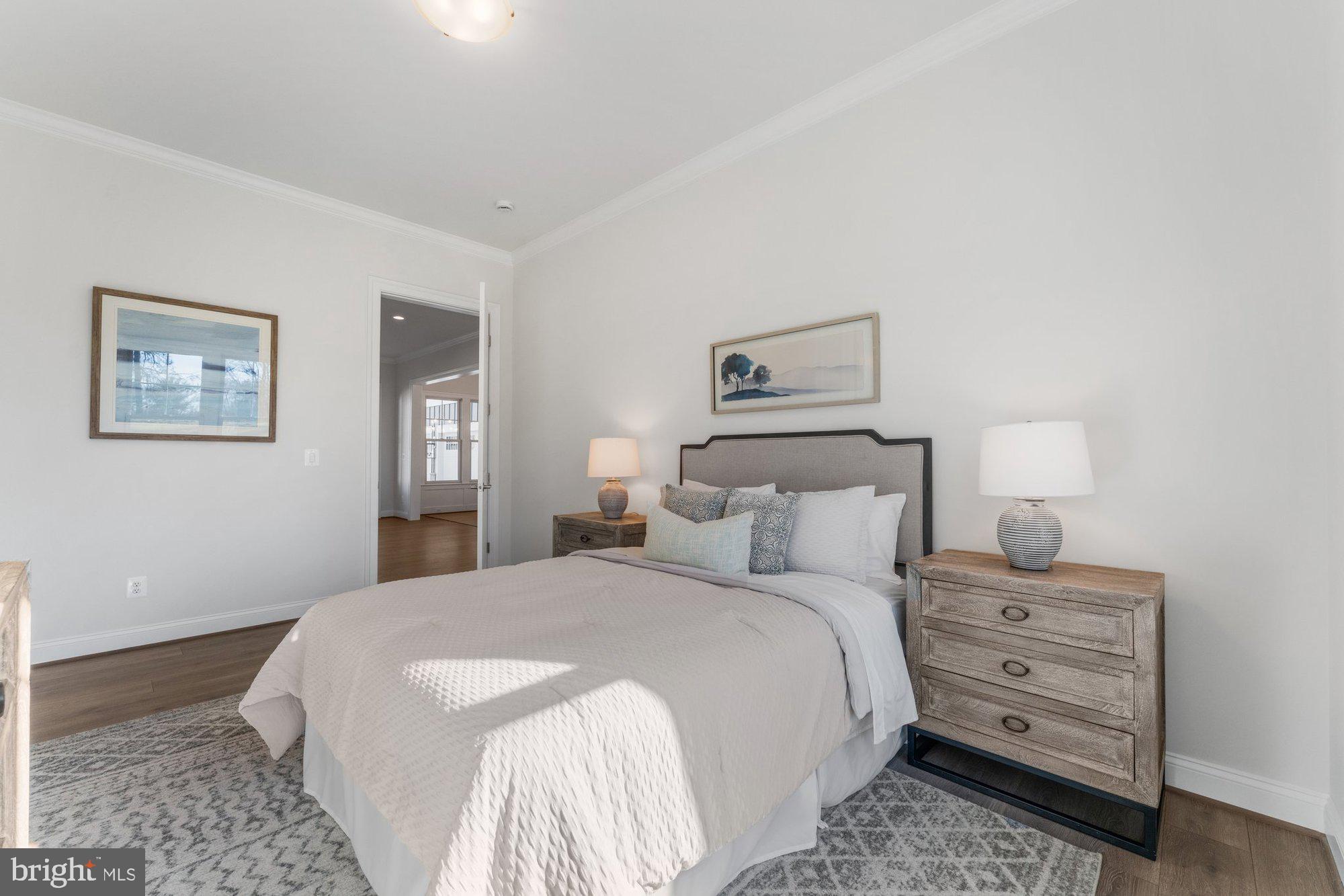 1767 Proffit Road Vienna, VA 22182 - Photo 47 of 117 a bedroom with a bed and a lamp on dresser