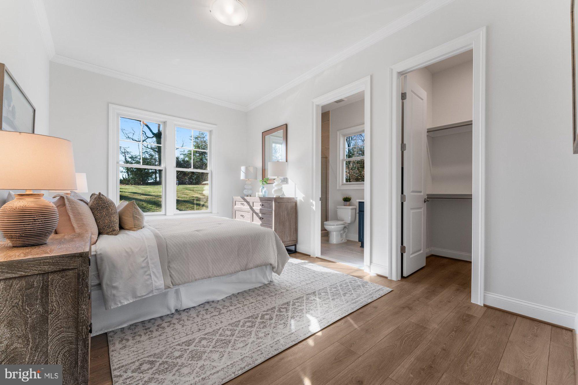 1767 Proffit Road Vienna, VA 22182 - Photo 48 of 117 a bedroom with furniture and a large window