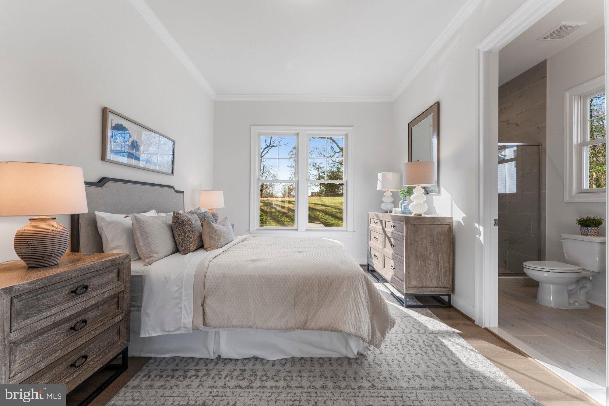 1767 Proffit Road Vienna, VA 22182 - Photo 49 of 117 a bedroom with a bed and a view of bathroom