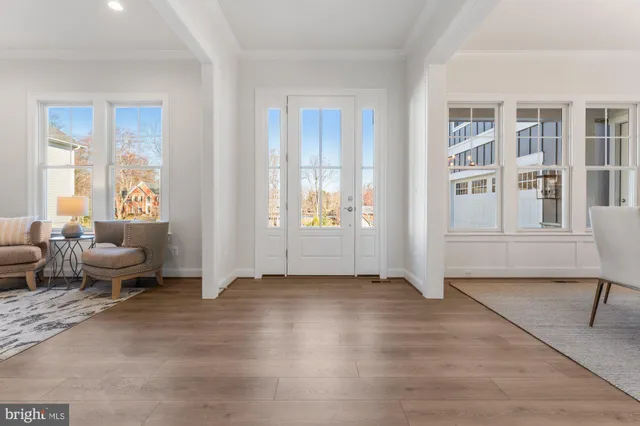 a view of a livingroom with furniture and an empty room