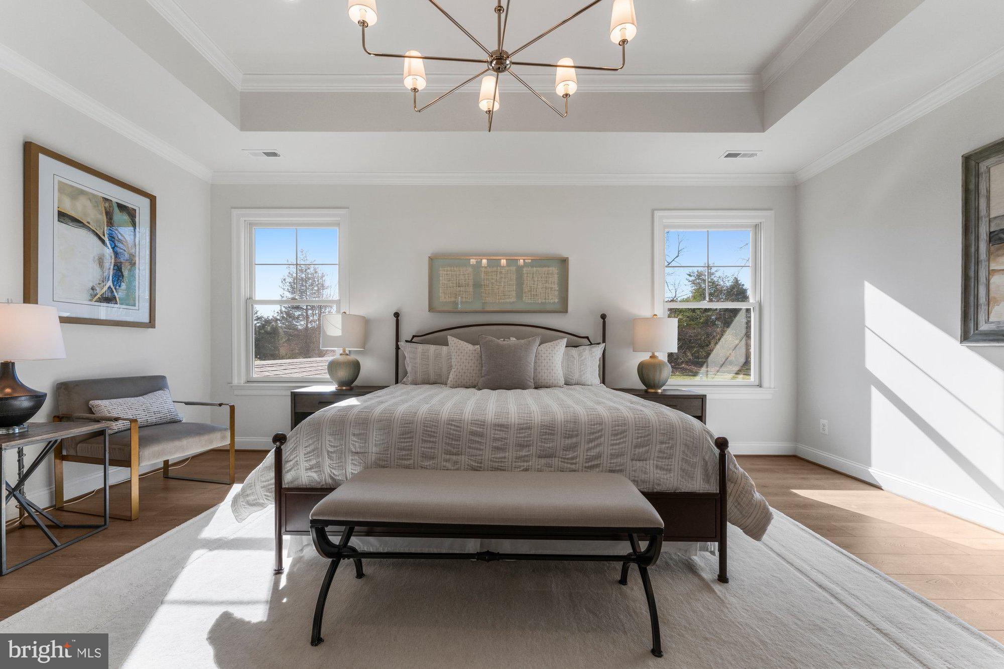 1767 Proffit Road Vienna, VA 22182 - Photo 56 of 117 a bedroom with a bed and a chandelier