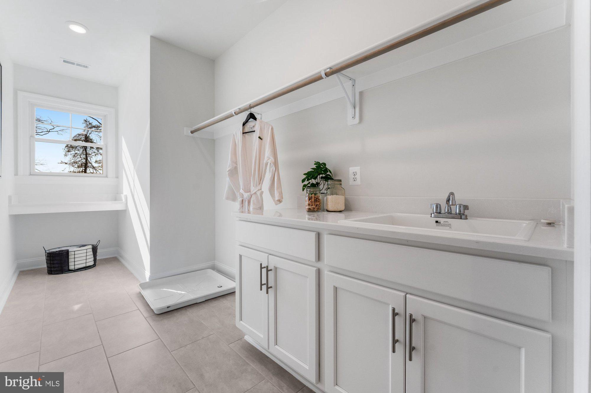 1767 Proffit Road Vienna, VA 22182 - Photo 69 of 117 a bathroom with a sink and a mirror