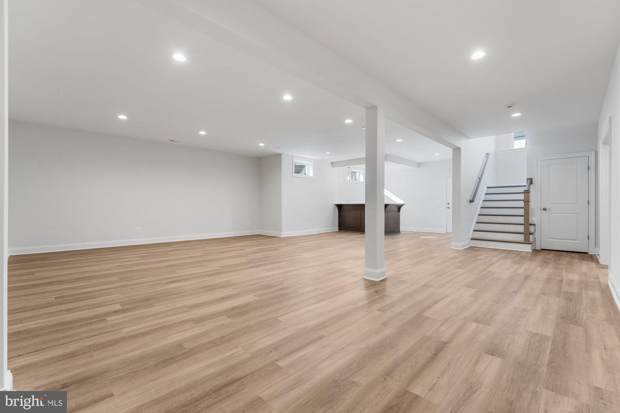 1767 Proffit Road Vienna, VA 22182 - Photo 7 of 117 a view of an empty room with wooden floor
