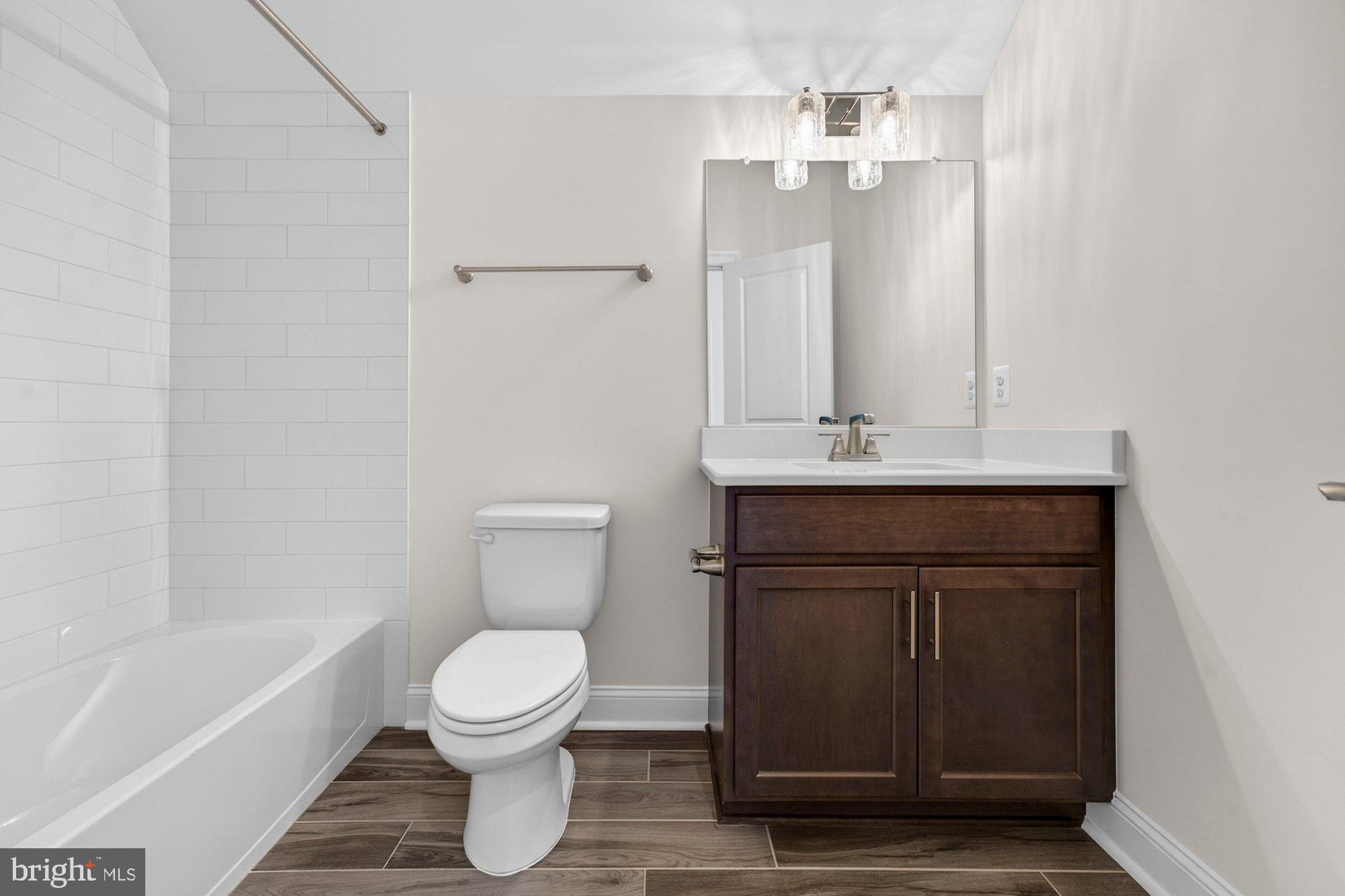 1767 Proffit Road Vienna, VA 22182 - Photo 84 of 117 a bathroom with a sink a toilet and shower